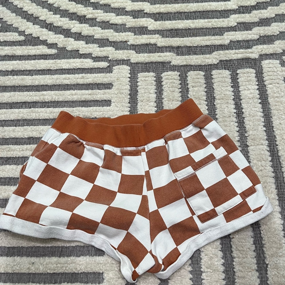 Out from under checkered shorts - Picture 8 of 11